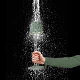 Sompex LED Outdoor Lampe Troll in Grün in einer Hand mit Wassertropfen (Outdoor geeignet)
